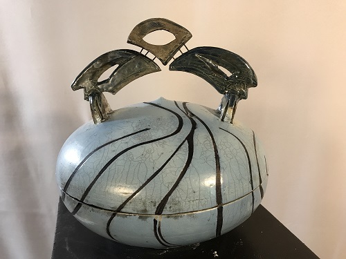 'Kisbah container,' Wheel thrown and raku fired with blue crackle, tape resist design, and nichrome wire.  10 inches diam. x 11 inches ht., by Joel Moses